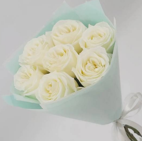 6 White Roses in a blue paper