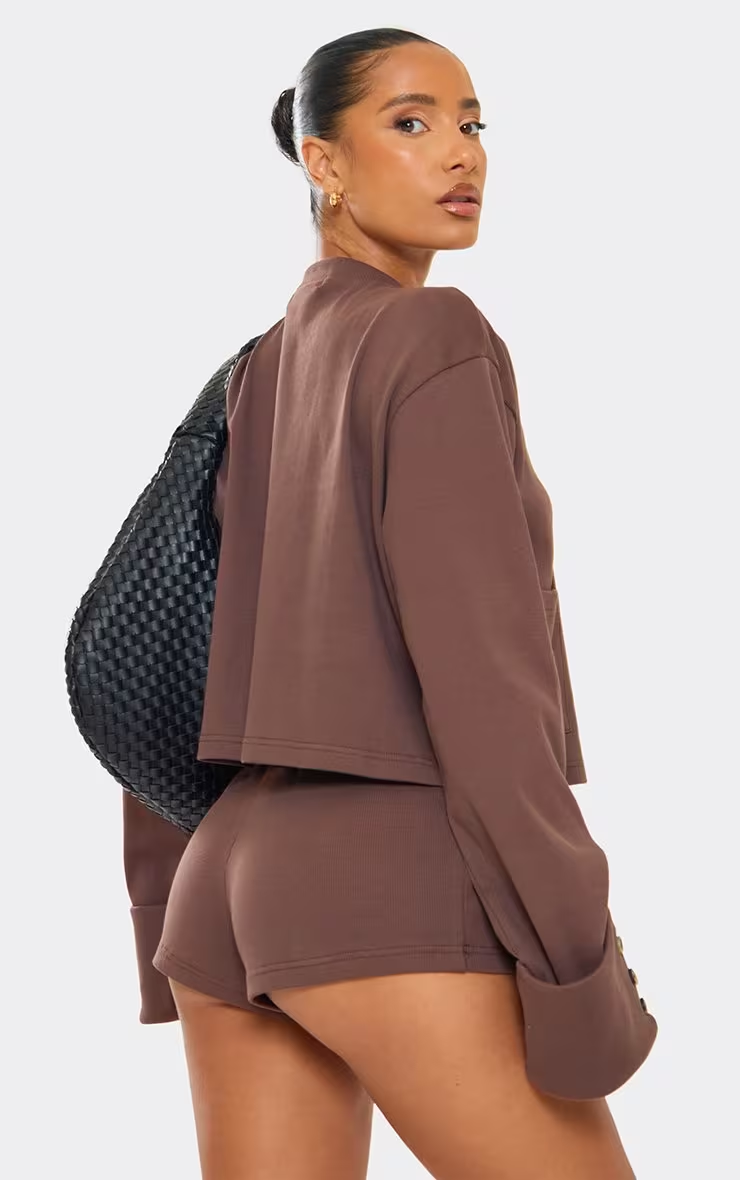 Chocolate-colored ribbed long-sleeved button-up front-pocket detail knitted cardigan, shorts, shoes