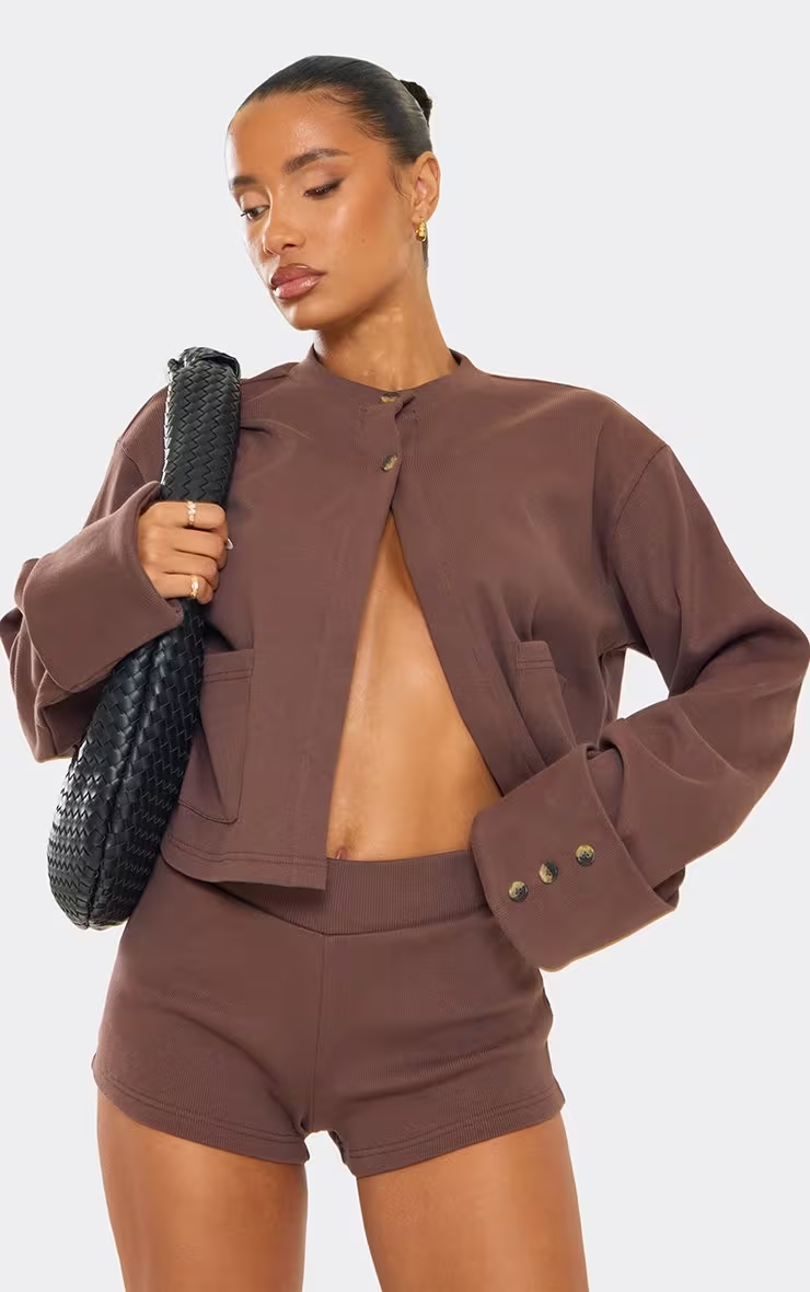 Chocolate-colored ribbed long-sleeved button-up front-pocket detail knitted cardigan, shorts, shoes